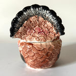 the tail of a ceramic-turkey-centerpiece