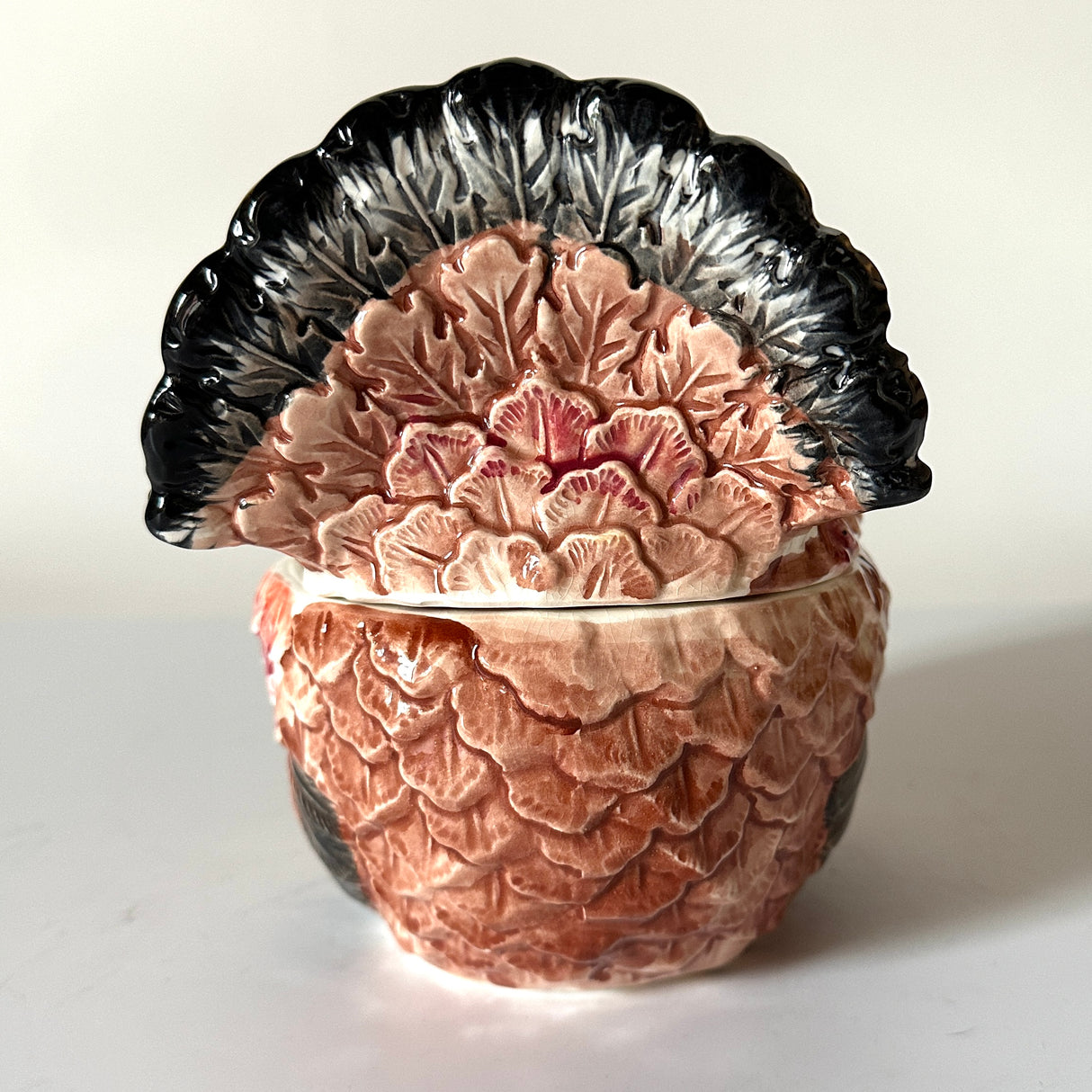 the tail of a ceramic-turkey-centerpiece
