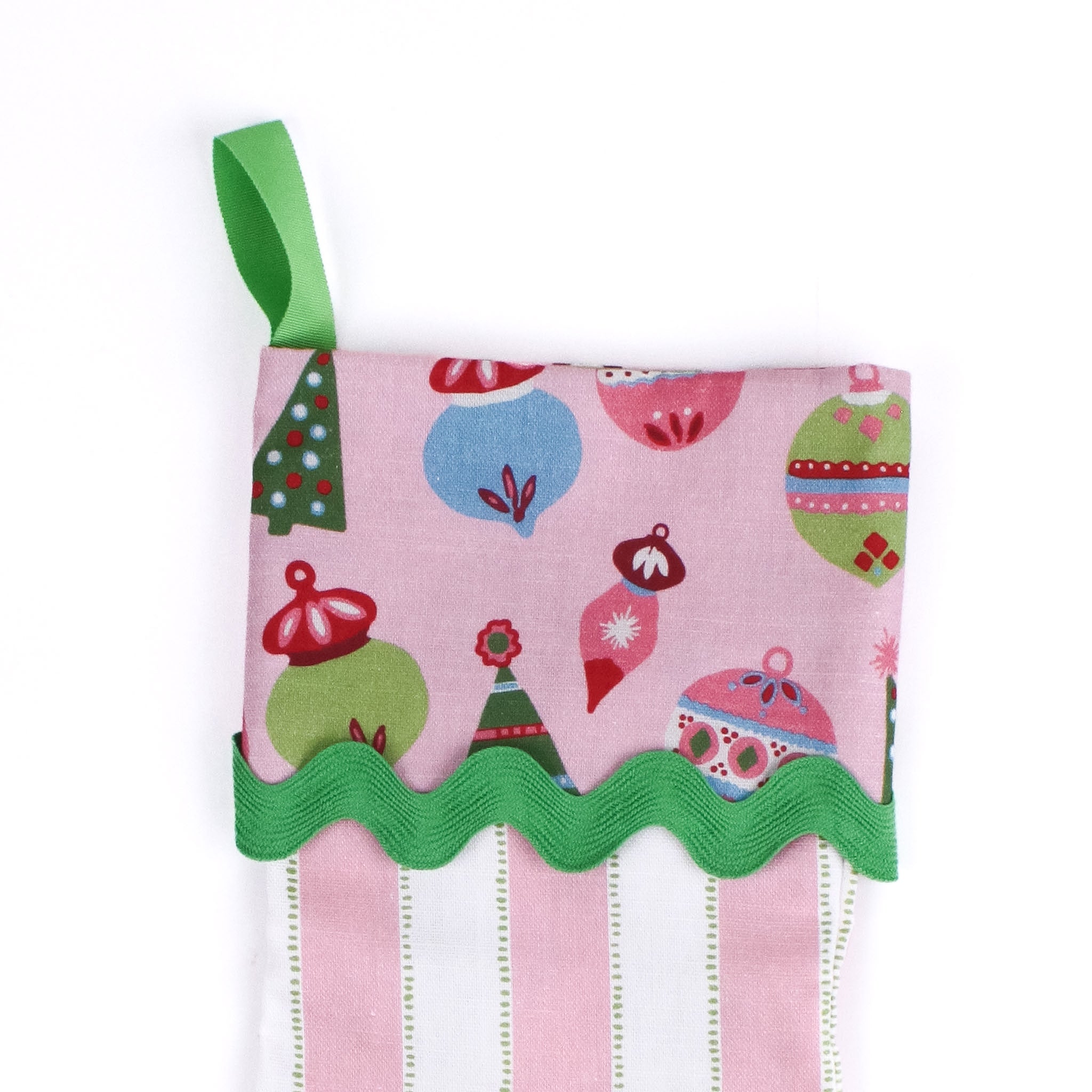 Pink and white striped Christmas stocking with colorful design on a white background