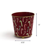 Red candy cane tole planter cachepot with hand-painted striped cane pattern, 6 inches tall and 4.75 inches wide decorative metal planter