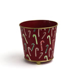 Red tole cachepot with hand-painted candy cane pattern and gold trim, standing upright.