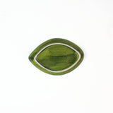 1 small green leaf shaped plate showing the back on a white background