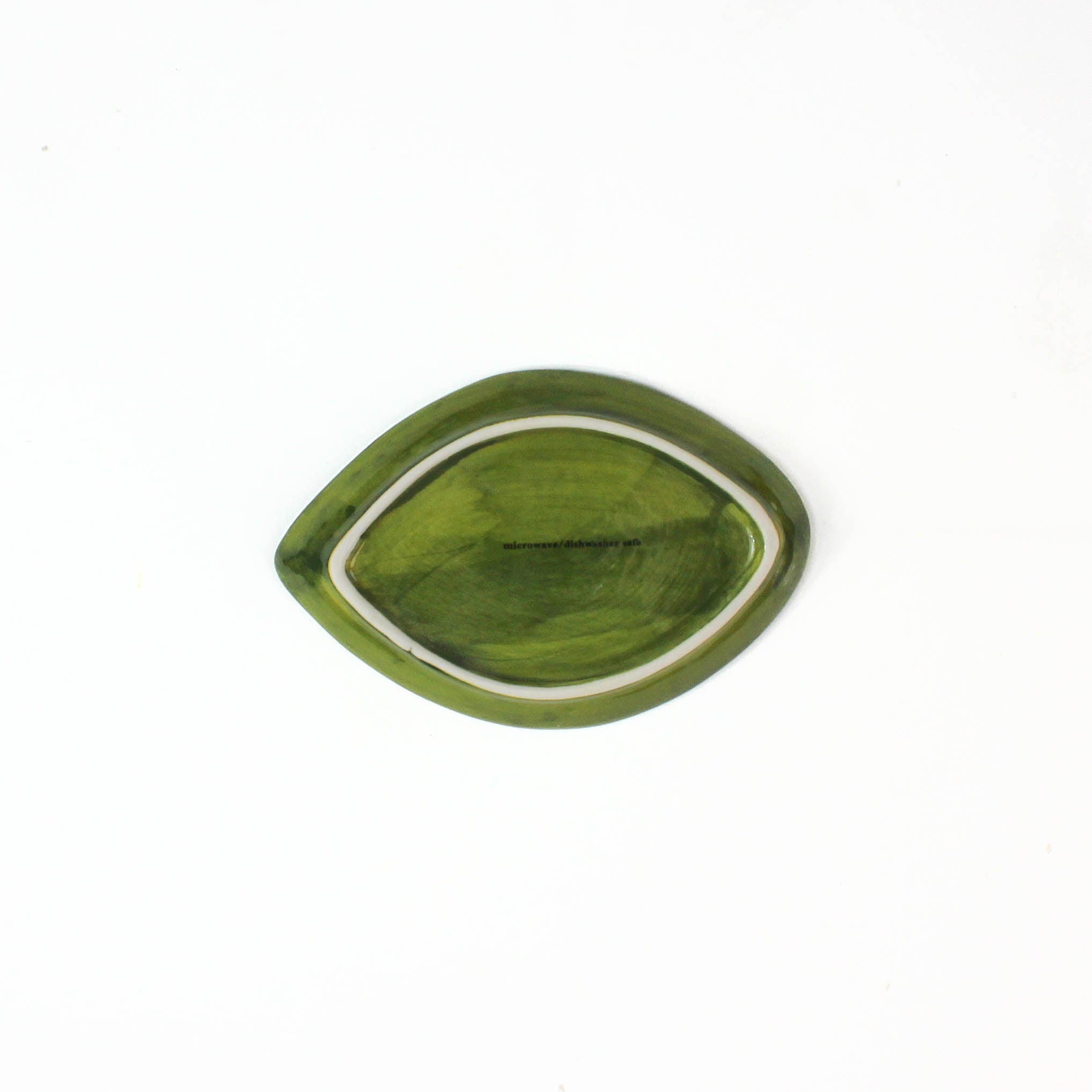 1 small green leaf shaped plate showing the back on a white background