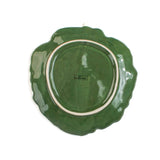 a ceramic cabbage leaf bowl bottom view in a white background
