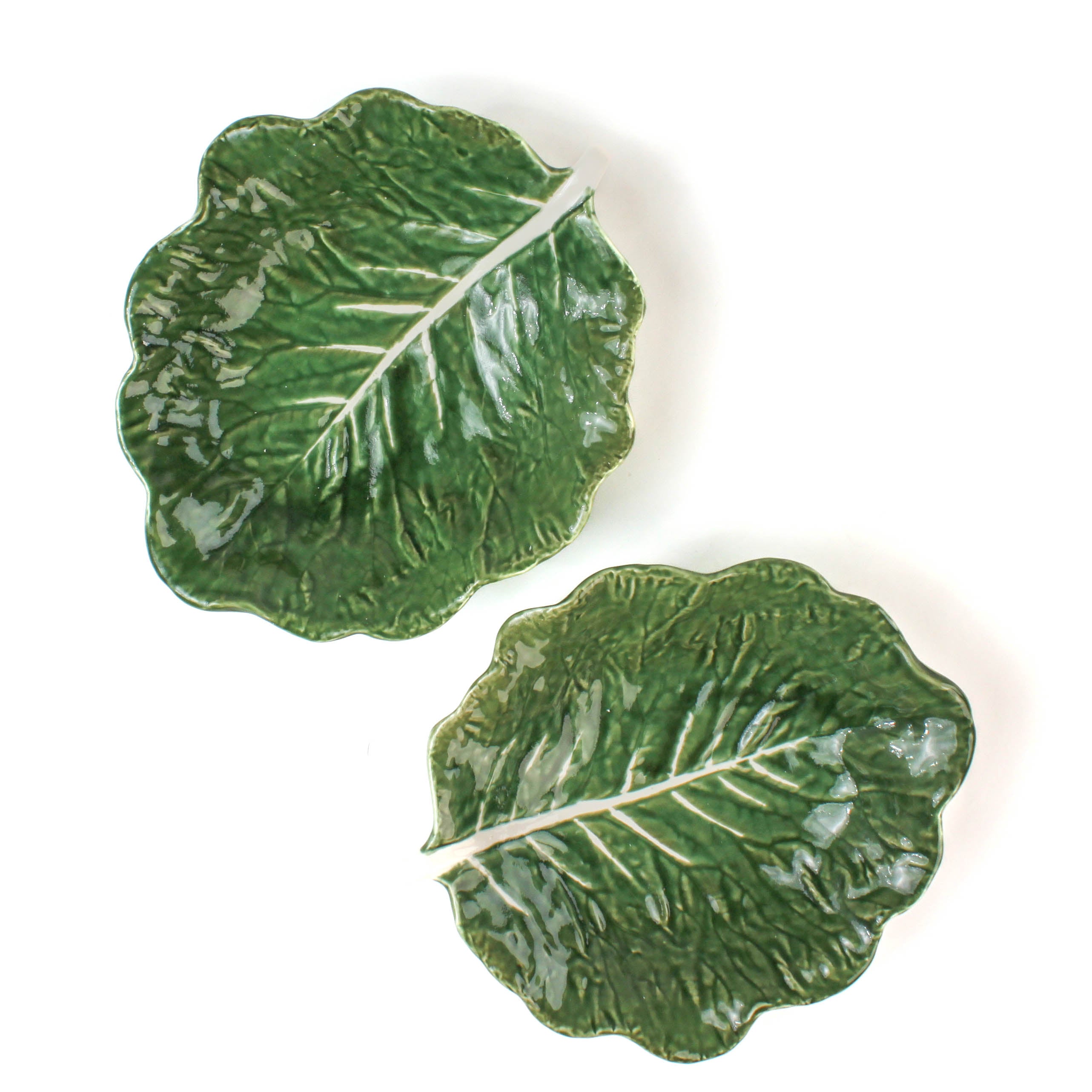 two set of ceramic cabbage leaf bowls top view in a white background