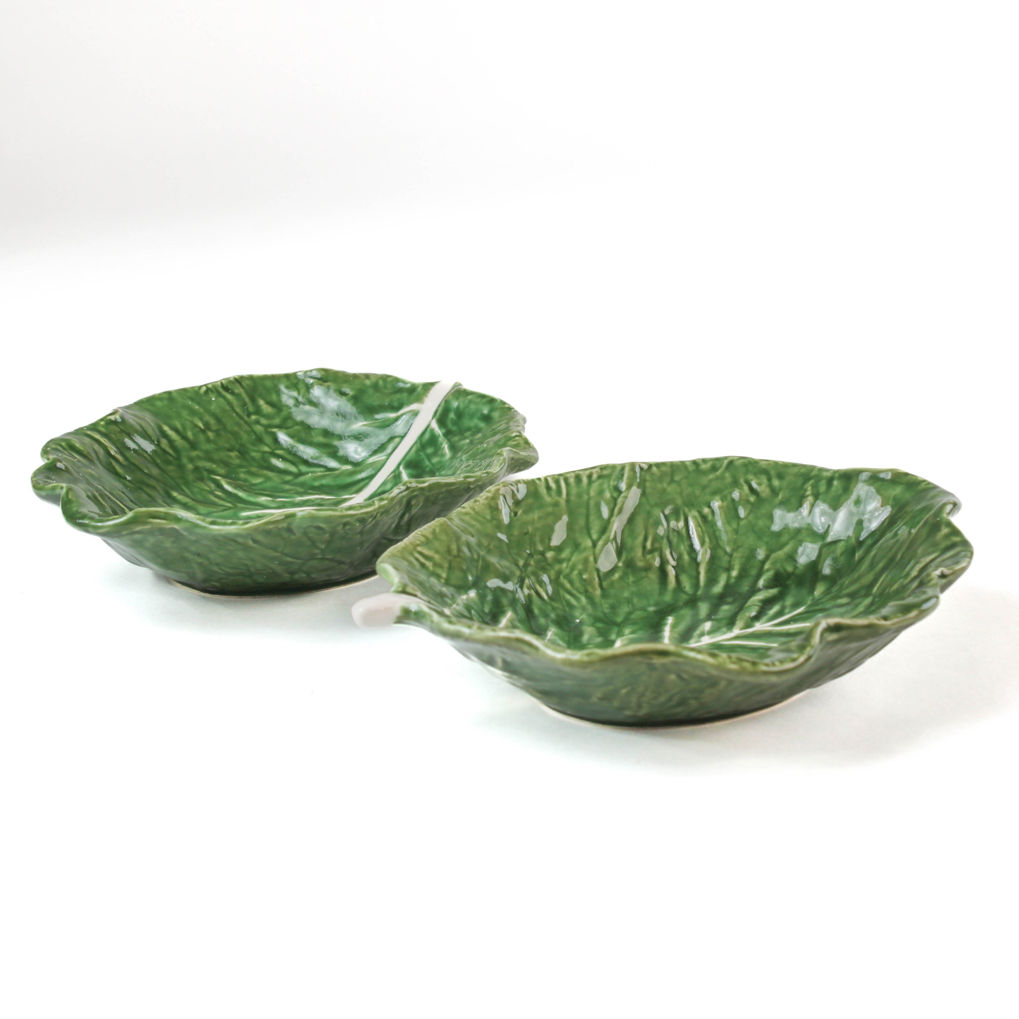 two set of ceramic cabbage leaf bowls  in a white background