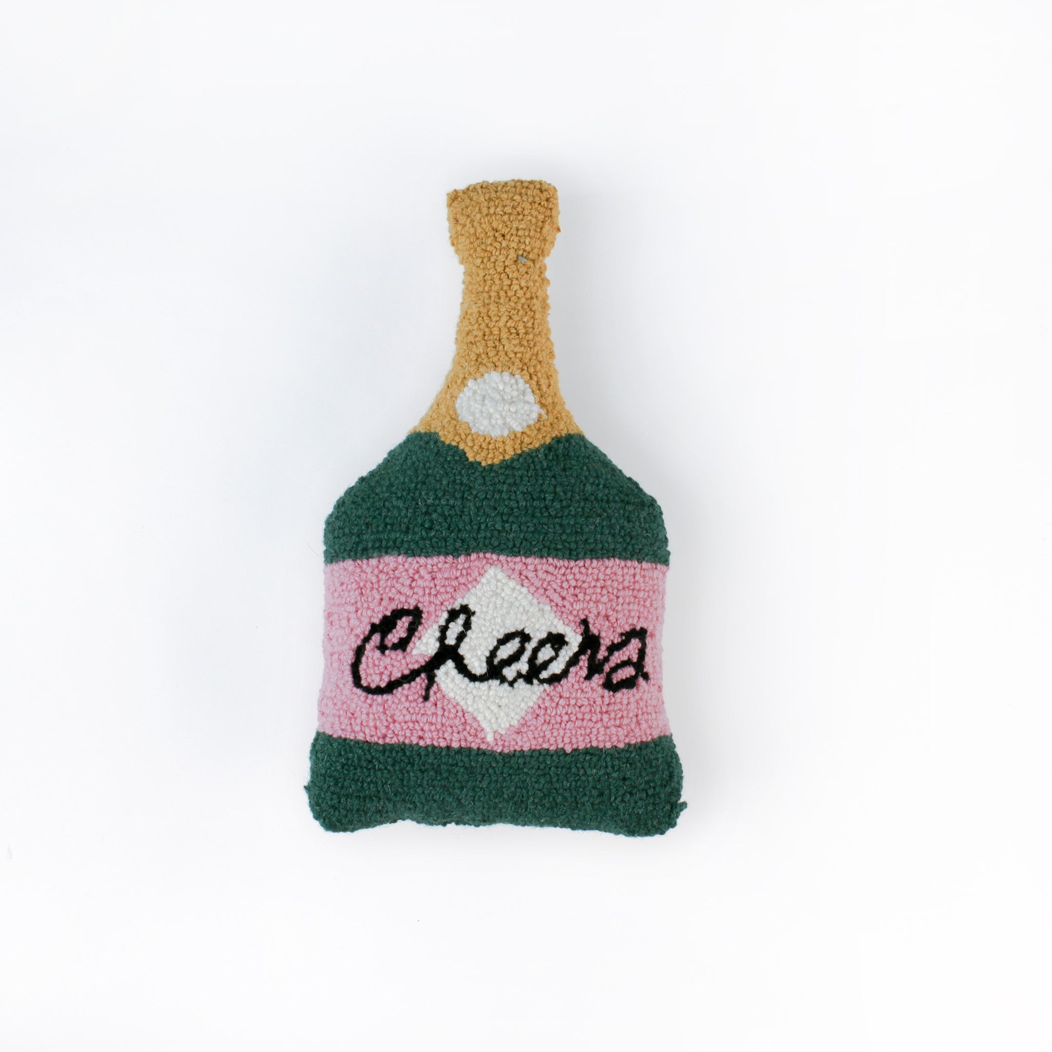 Bottle-shaped decorative pillow with a hooked texture, designed like a champagne bottle in green, pink, and gold colors, featuring the word “Cheers” on the label.
