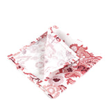 Red dragon pattern cloth napkin set folded on a white background, bold Asian-inspired table linen perfect for Christmas tea towel styling, festive entertaining, and seasonal home décor