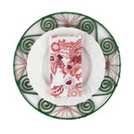 Red dragon cloth napkin folded on a white plate with green decorative charger, elegant holiday table setting perfect for Christmas tea towel styling, seasonal entertaining, and festive home décor