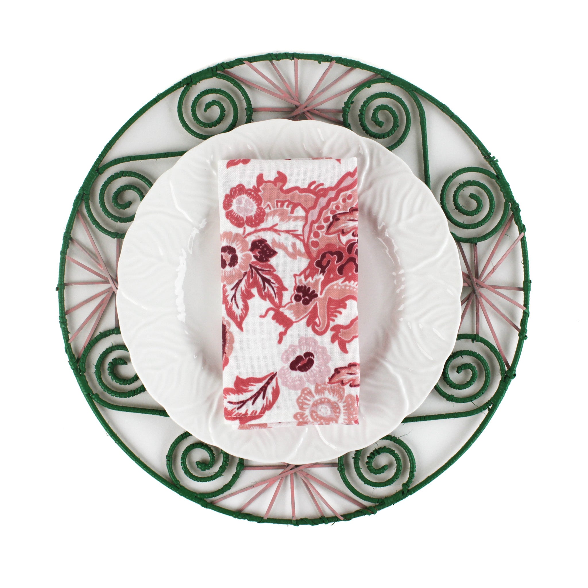 Red dragon cloth napkin folded on a white plate with green decorative charger, elegant holiday table setting perfect for Christmas tea towel styling, seasonal entertaining, and festive home décor