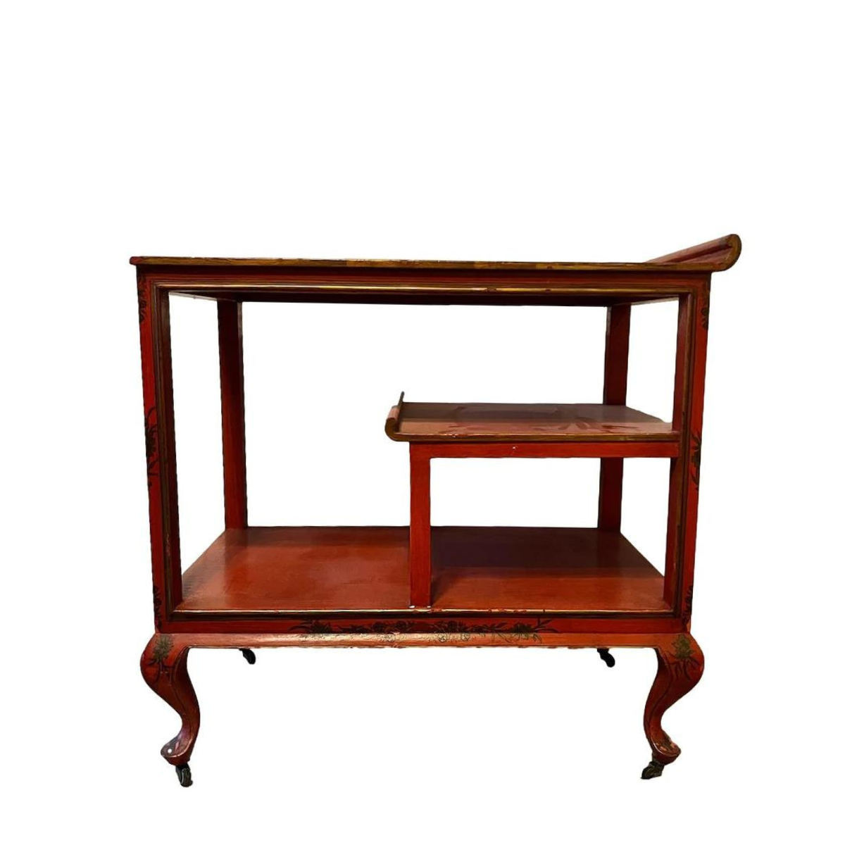 a dark wood chinoiserie side table with two tiers and on rolling casters.