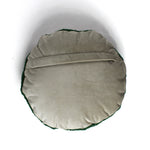Back view of a round decorative pillow with a soft beige fabric and envelope-style closure.