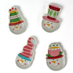 Four colorful snowman ceramic christmas plates on a white background
