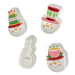 Four colorful snowman ceramic christmas plates on a white background