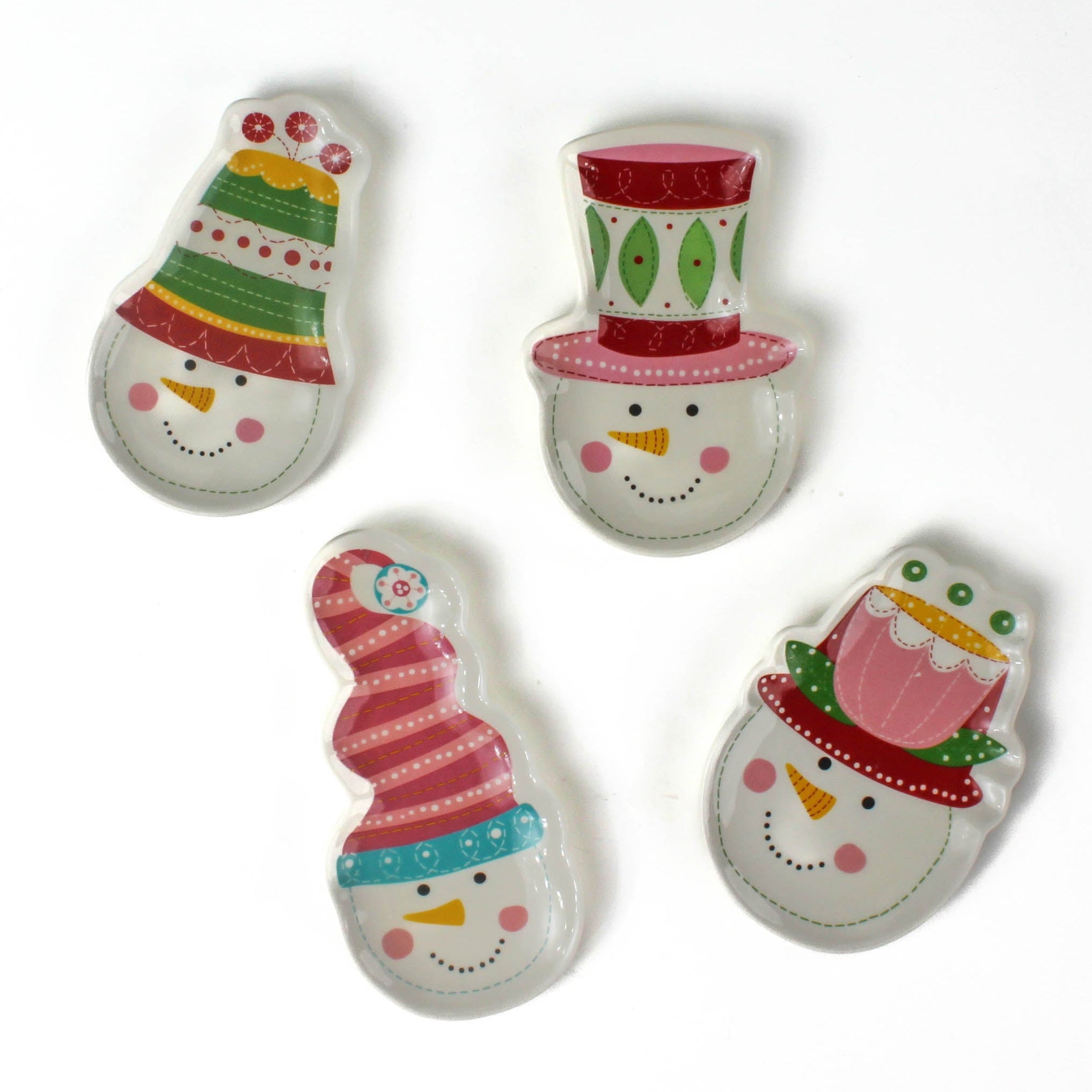 Four colorful snowman ceramic christmas plates on a white background