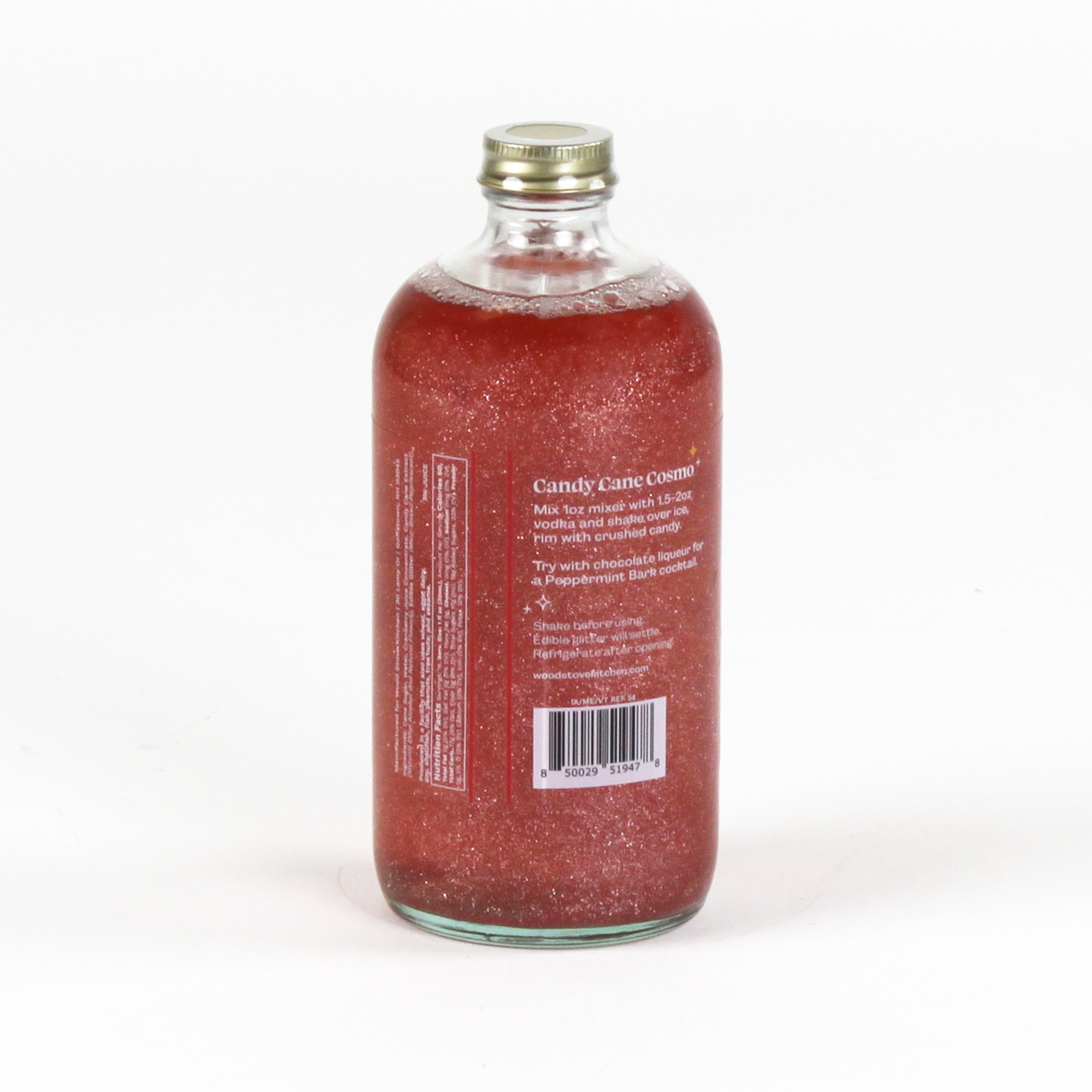 a bottle of candy cane peppermint mix. the contents are red and glittery and the largest text reads "Candy Cane Cosmo" 