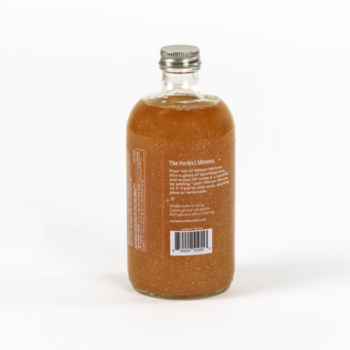 Bottle of 'The Perfect Mimosa' cocktail mix on a white background