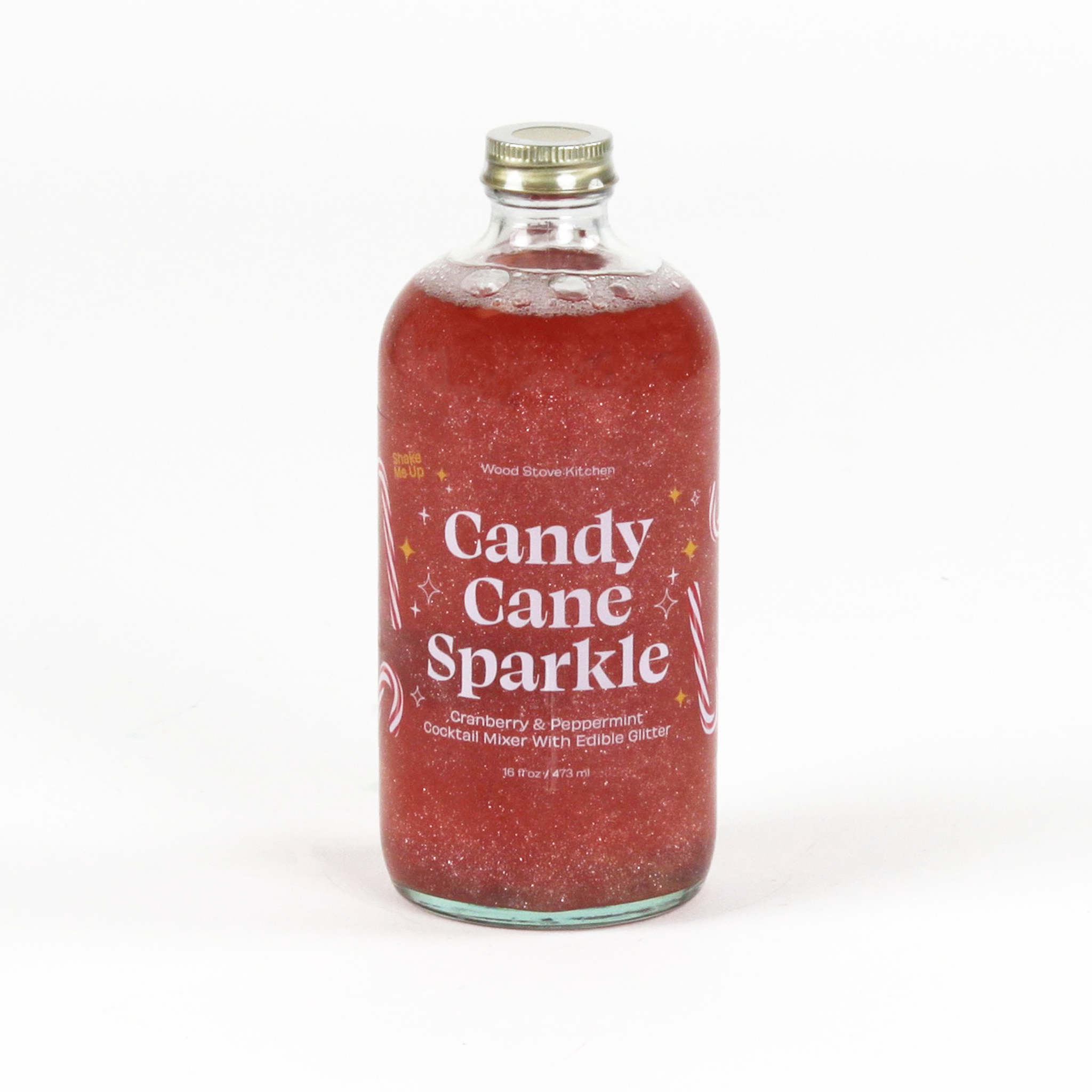 a bottle of candy cane peppermint mix. the contents are red and glittery and the label reads "Candy Cane Sparkle" 