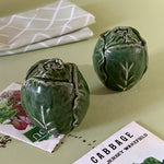 a pair of ceramic cabbage salt and pepper shakers.