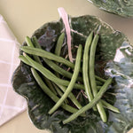 a ceramic cabbage leaf bowl from madcap cottage filled with green beans