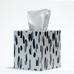 a blue and white tissue box cover patterned with a brushstroke motif called club house by madcap cottage