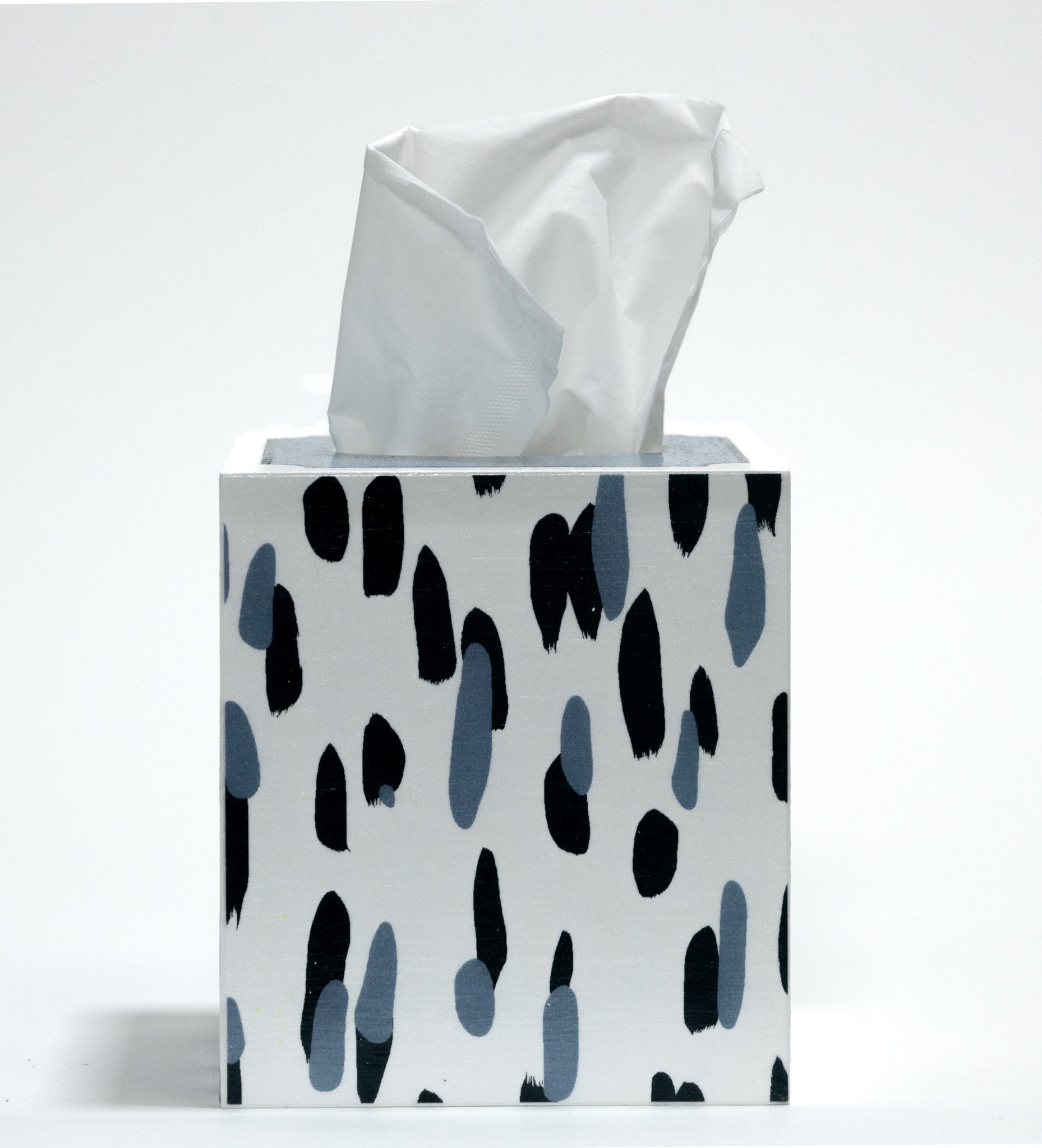 A blue and white tissue box covered with a brushtroke motif pattern called club house by madcap cottage