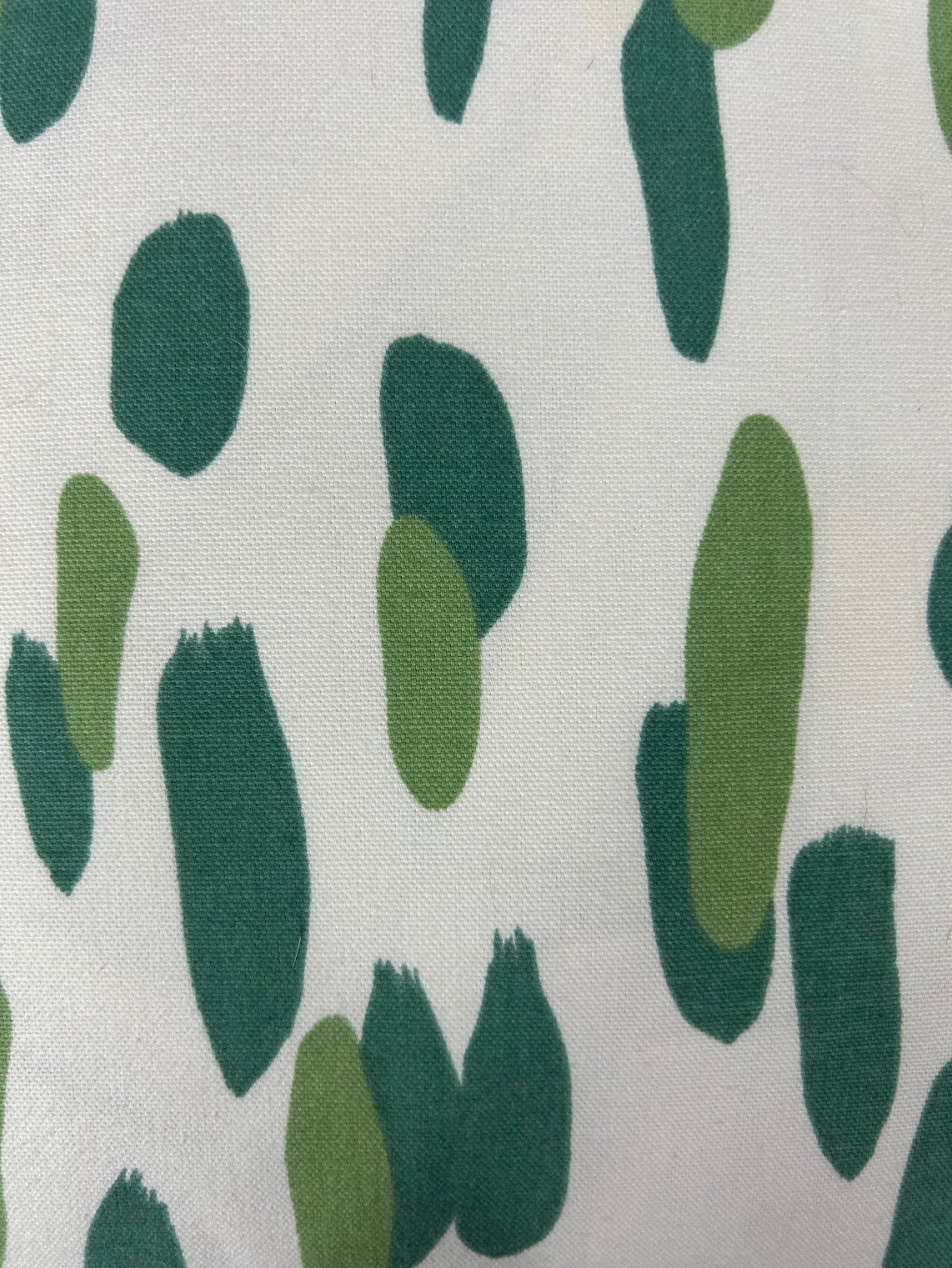 Close up Club House Brushstroke throw pillow with an abstract green brushstroke pattern on a white background.