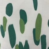 Close up Club House Brushstroke throw pillow with an abstract green brushstroke pattern on a white background.