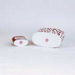 bottom of 2 madcap Cottage caddies with red abstract patterns on a white background