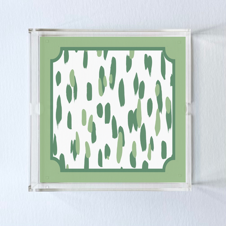 a square acrylic tray with a green and white brushtroke pattern on the base. 
