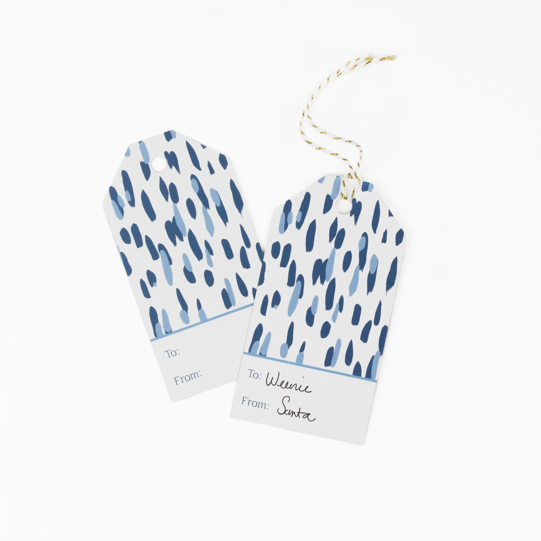 A blue gift tag with a geometric pattern, displayed on a white background