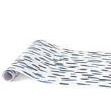 Clubhouse blue paper table runner with abstract blue and gray pattern design.