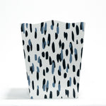 a blue and white wastepaper basket with a brushtroke motif pattern called club house from madcap cottage