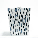 a blue and white wastepaper basket with a brushtroke motif pattern called club house from madcap cottage
