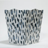 a blue and white wastepaper basket with a brushtroke motif pattern called club house from madcap cottage