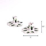 Green scalloped candle holder with dimension of 5" x 2.5".