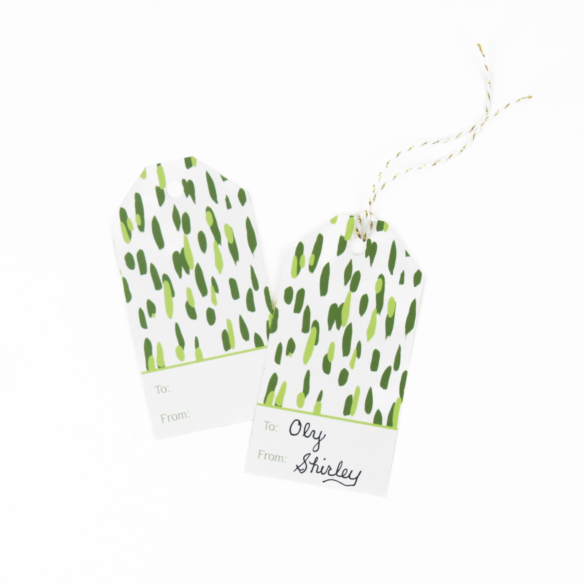 A green gift tag with a geometric pattern, displayed on a white background