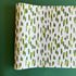 A green and white paper table runner with a brushtroke pattern