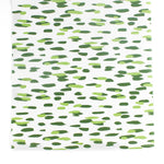 A green and white paper table runner with a brushtroke pattern