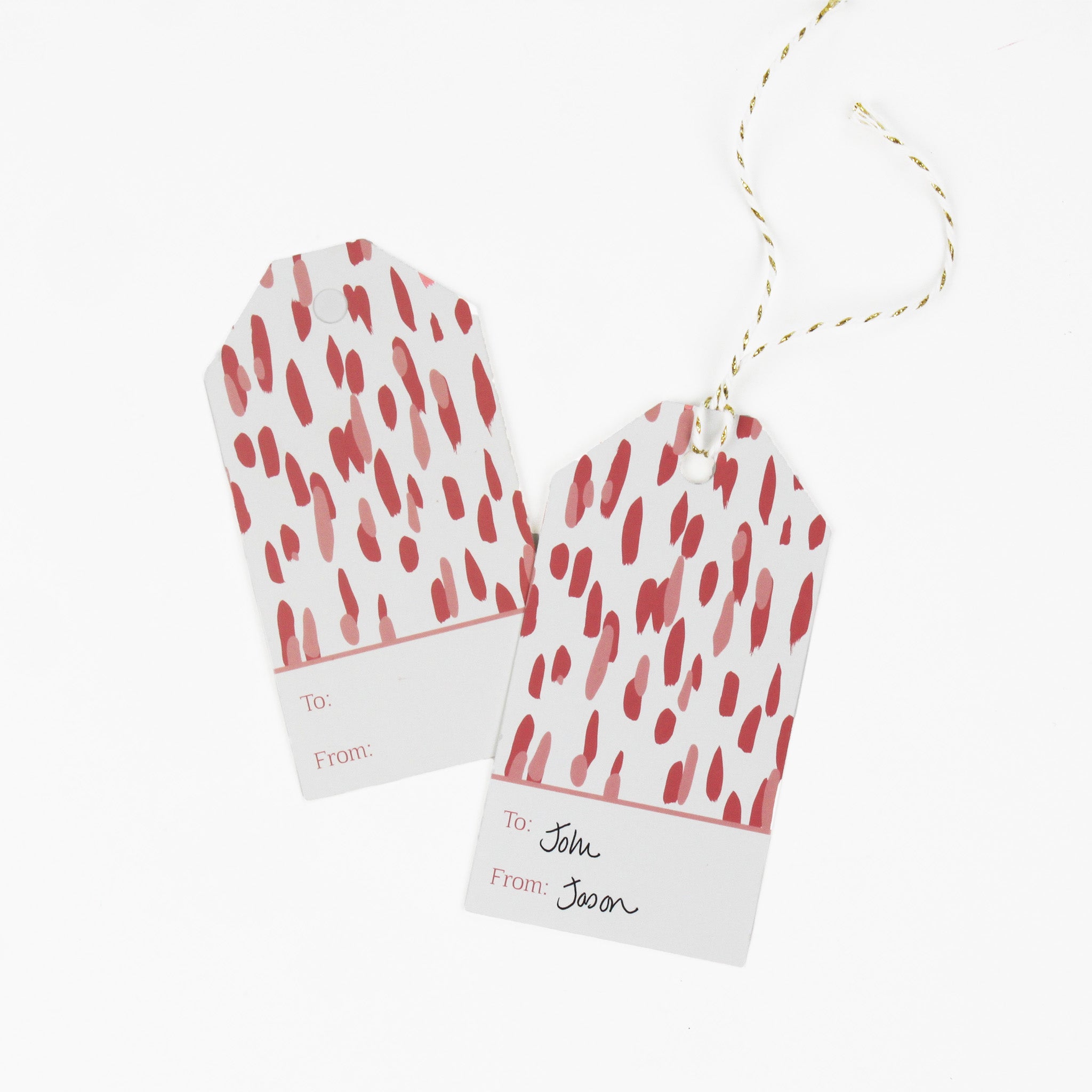 A pink gift tag with a geometric pattern, displayed on a white background