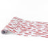 Clubhouse red paper table runner with abstract red brushstroke pattern design.