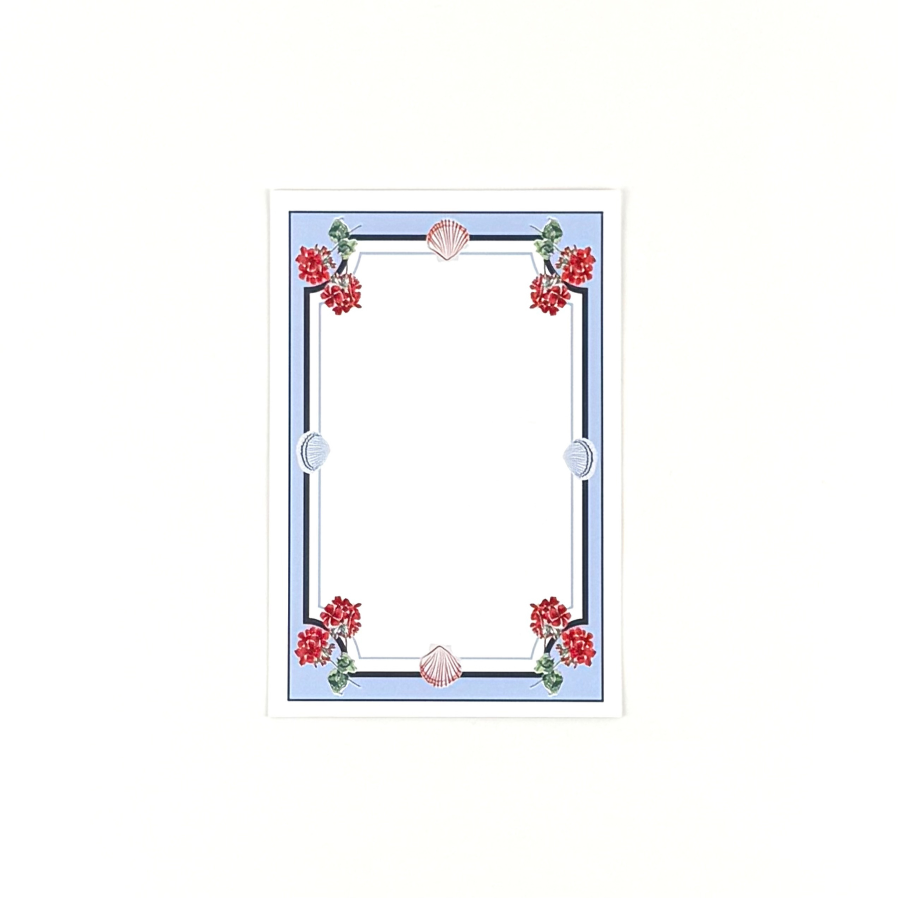 A coastal themed blank menu card featuring red geranium flowers and seashell border accents on a white background.