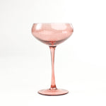 a pink coupe glass from madcap cottage in a white background