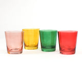 Four colored drinking glasses in pink, red, green and yellow from madcap cottage