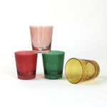 Four colored drinking glasses in pink, red, green and yellow from madcap cottage