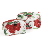 Cottage Grove Geranium is a floral toiletries bag with a red, green, and white color scheme, featuring a geranium design.