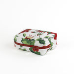 a large Cottage Grove Geranium, a floral toiletries bag with a red, green, and white color scheme, featuring a geranium design.