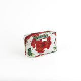 a medium Cottage Grove Geranium, a floral toiletries bag with a red, green, and white color scheme, featuring a geranium design.