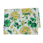 a white floral tea towel with a yellow geranium pattern against a white background 