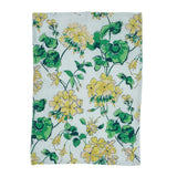 a white floral tea towel with a yellow geranium pattern against a white background 